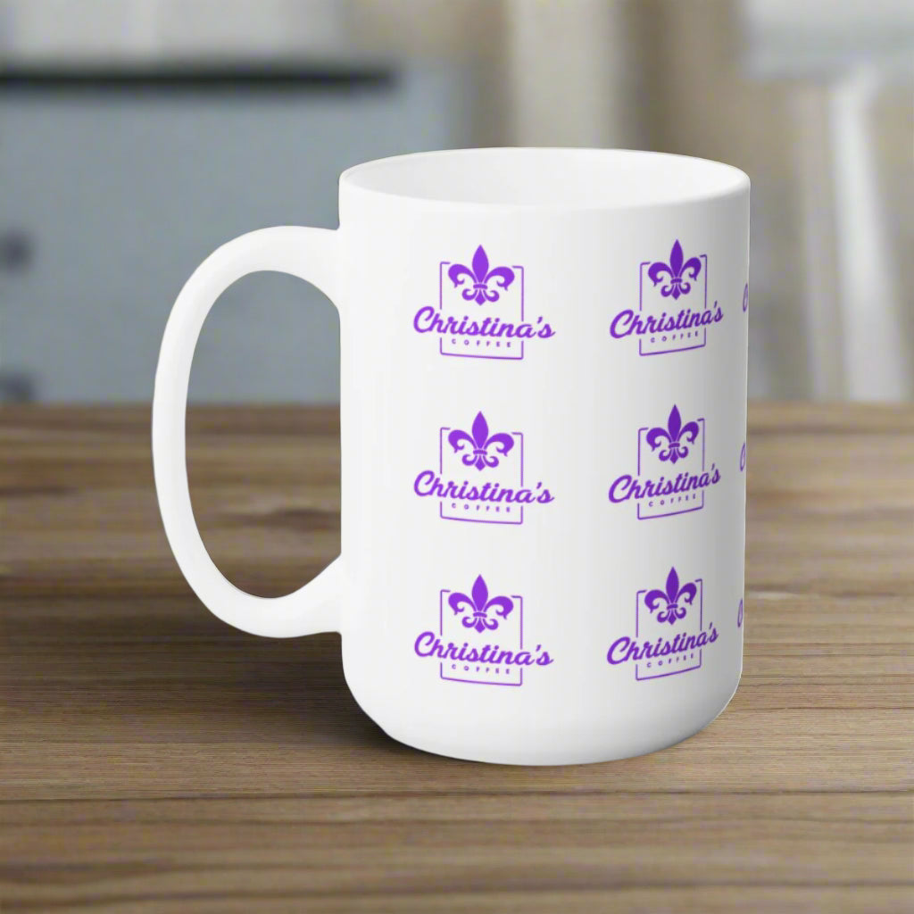 Mockup view of Christina's Coffee Mardi Gras Purple Coffee mug on a table.